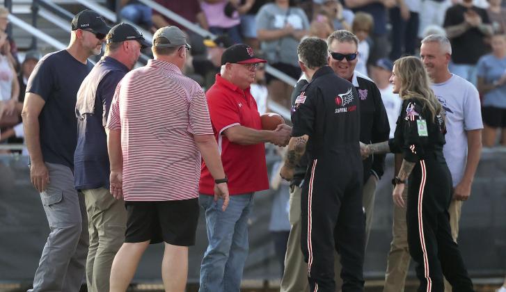 Pauls Valley Principal Kirk Moore and Assistant Principal Chad Chronister received a special game ball from the Memorial Health System of Southwestern Oklahoma Friday night. The presentation took place during a fly-in at Marlow, honoring the two men for their bravery during the school shooting earlier this year. News Star photos by Mike Arie