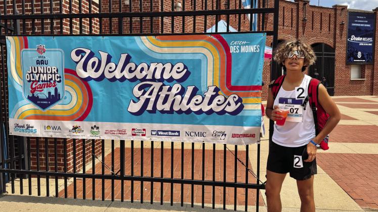 David Ponce stands in front of the athlete entrance for the AAU Junior Olympic Games, where he qualified for the 800-meter run. Courtesy photo