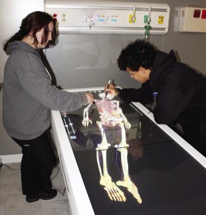 Mrs. Thompson’s anatomy and physiology students, Becca Armstrong and Adam Reed, are fully engaged while using the Anatomage Table.