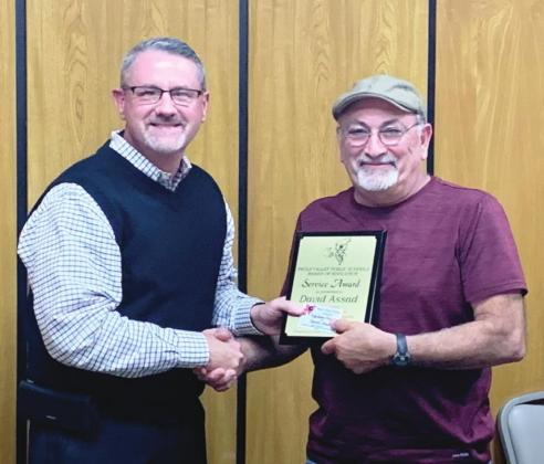 Pauls Valley Superintendent Mike Martin presents School Board President David Assad with a Five-Year Service Award.