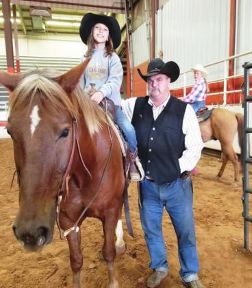 Highly-trained cowboy fashion reporter Shawn Williams, his granddaughter Miya Johnson and “Cheech.” Submitted photo