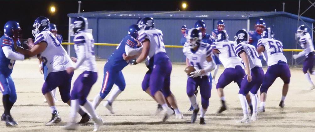 Badger Hunter Burger looks for an opening in the Eagles’ defensive line to run the ball in last Friday's game. Photo by Chris Mackey