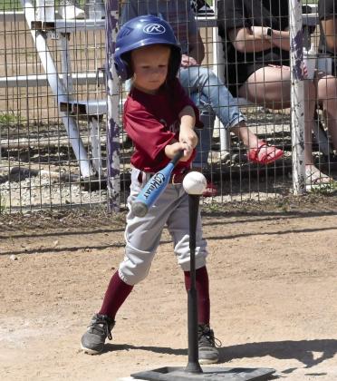 A Wynnewood Savage T-ball batter lines up for a big swing during a recent game. News Star photo by Don Coffey