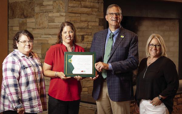 Stacey McCaa of Elmore City was recently recognized as the Garvin County 4-H Volunteer of the Year. McCaa serves as the Elmore City 4-H Club leader and Shooting Sports Club leader for Garvin County. Pictured left to right are Tracie Mullendore, Garvin County OSU Extension program assistant; McCaa; Steve Beck, State 4-H Program Leader; and Melissa Koesler, Garvin County OSU Extension director.