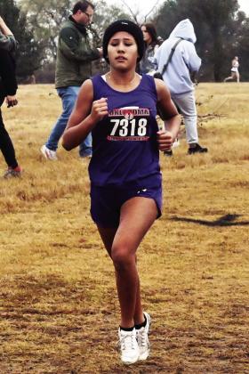 Elmore City-Pernell’s Remlee McIntosh (l) placed 4th in Class A at the OSSAA State Cross Country Championships at North Rock Creek. News Star photo by Don Coffey