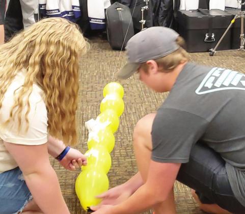 Freshmen in ECP's Aviation I class learn about propulsion using balloons as rockets.