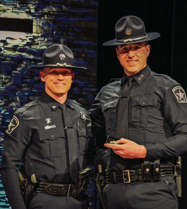 Chickasaw Lighthorse Assistant Chief of Police Terrance Bush (left) and Officer Brycen Ingrum are pictured following Ingrum’s graduation from the Moore Police Department training academy Feb. 21 in Moore. Officer Ingrum is assigned to the Newcastle Precinct, which serves the northwestern region of the Chickasaw Nation.