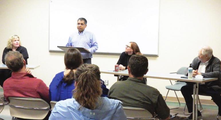 Madhukar Sharma, the new owner of Southern Plains Medical Center of Garvin County, spoke to community leaders Tuesday at the hospital. Hospital CEO Kimberly Tucker (seated to the right of Sharma) and former owner Mike Schuster (seated far right) also spoke to community members during Tuesday's meeting.