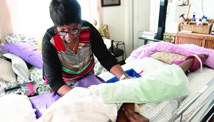 Oklahoma City resident Francis Johnson, 64, left, retired early to for her 89-year-old mother full time after three strokes left Maybelle Thomas Fisher bedridden and unable to speak. (Whitney Bryen/Oklahoma Watch)