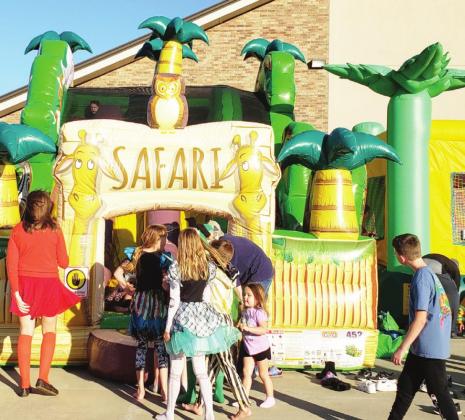 The bouncy house is always a favorite for kids of all ages. The fun was worth the wait at Trunk-or-Treat. Photo by Ashley Gallagher.