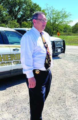 Garvin County Sheriff Jim Mullett gave an update regarding the discovery of a body believed to be fugitive Kameron Jenkins at a press conference near the crime scene Tuesday afternoon. News Star photo by Suzanne Mackey