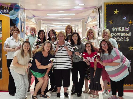 Maysville Elementary School Team shows off their Reading Rope models made during a training from the Oklahoma Literacy Initiative. Pictured, from left, front: Maggie Shannon, Susan Green, Kendra Schenk (OLI Consultant), Kimberly Layton, Mandy Russell, Kelsey Ring; back: Kevan Fortney, Principal John Edwards, Kortney McCaskill, Jennifer Nimmo, Kacee Uhles, Mandee Anderson and Jessica Dean. Courtesy Photo