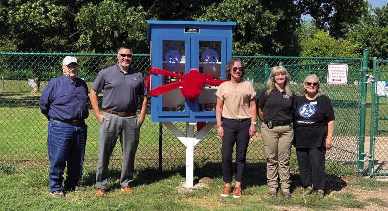 Pauls Valley City Manager Joe Livingston, City Councilman Kahn Nirschl, pantry sponsor Cheryl Flowers, Camryn Williams with PV Animal Welfare and Pauls Valley Animal Welfare Society President Marjie Little were on hand Friday to dedicate the new Pets &amp; People Pantry. Photo by Suzanne Mackey