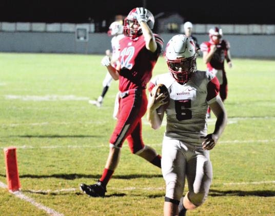 Nigel Reid scores a touchdown against Fox. Photo by Denny Park