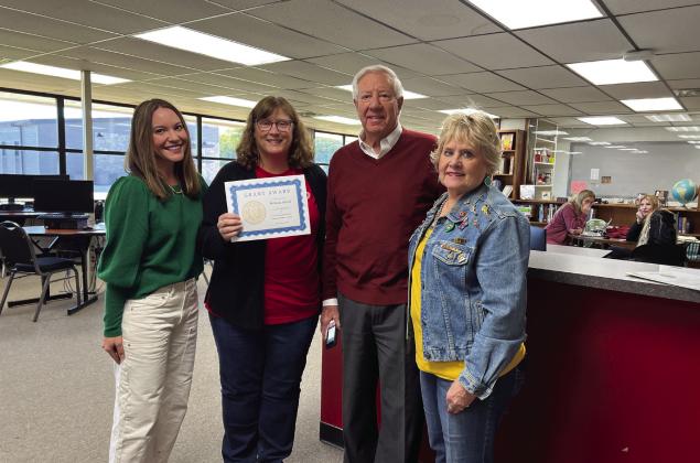 Melinda Alfred (second from left), librarian for Pauls Valley’s Junior High and High School, was one of 43 teachers to receive a classroom grant from the PV Foundation for Academic Excellence this year. Presenting the award were (left to right) Camille Milligan, Dan Barney and Debra Ely. News Star photo by Suzanne Mackey