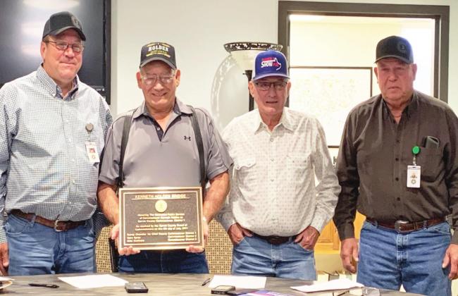 A new bridge over Rush Creek in the western part of Garvin County will be named the Kenneth Holden Bridge in honor of retired Garvin County Commissioner for Dist. 1 Kenneth Holden. A bronze plaque that will eventually be installed on the bridge was presented to Holden at the Garvin County Board of Commissioners' regular meeting Monday. Pictured left to right are Dist. 3 Commissioner Mike Gollihare, Holden, Dist. 2 Commissioner Gary Ayers and Dist. 1 Commissioner Randy Chandler.