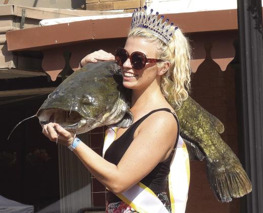 The 2026 Okie Noodling Queen, Shiane Mann, poses for pictures after being crowned at Saturday’s tournament. News Star photo by Chris Mackey