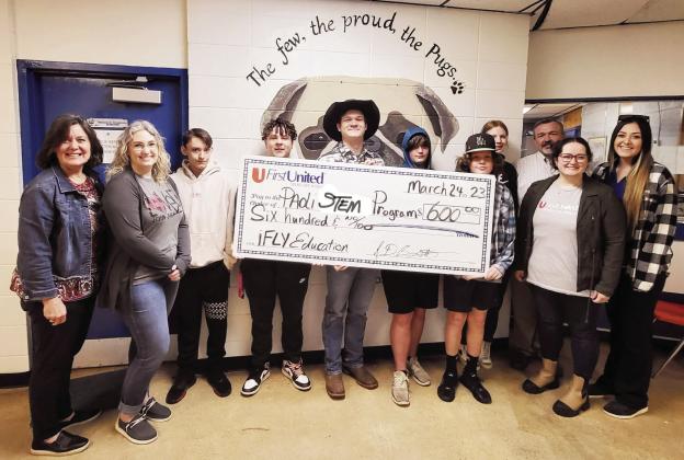 Pictured left to right are Della Wilson and Danielle Caldwell with First United Bank; Paoli Alternative Education students Kalib Hobbs, Kaleb Brown, Isaac Burt, Braddyn Swafford, Baylon Wigley and Eveyon Martin; Paoli Superintendent David Morris; Grace Farnan with First United Bank; and Lauren Cook, director of Paoli’s Alternative Education Program.