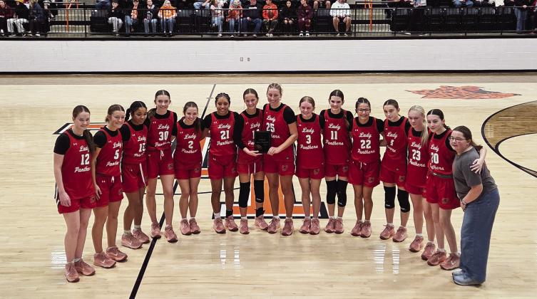 The Pauls Valley Lady Panthers pose with their third-place plaque at the Charles K. Heatly Tournament after defeating the Lindsy Leopardettes 43-22. News Star photo by Jennifer Lindsey