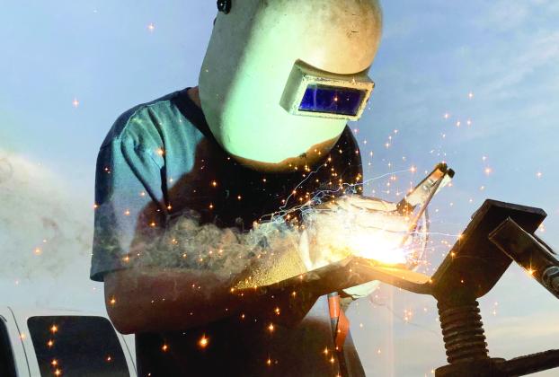 “Arc Welder Welding” by Cooper McKinzie of Wynnewood won Best of Show and first place in the People category in this year’s 4-H photography contest.
