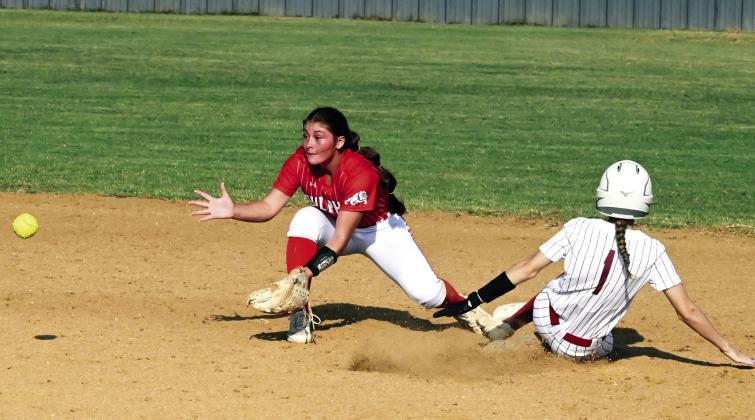 Wynnewood‘s Olivia White slides into base during Monday’s 6-2 home loss to Sulphur. News Star photo by Don Coffey