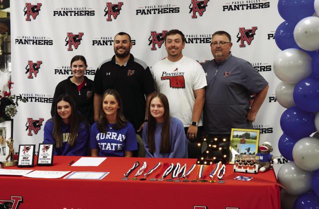 Pauls Valley senior Erin Gray (seated center) signed a letter of intent Wednesday to play golf at Murray State College this fall. News Star photo by Chris Mackey