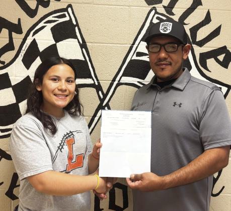 Aura Valenzuela of Lindsay is being awarded her scholarship check from MATC Automotive Service Technician teacher Alex Juardo. Courtesy photo