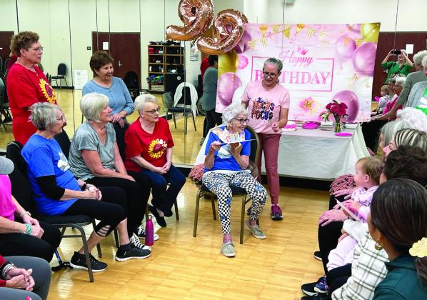 Betty Lam (seated center) celebrated her 99th birthday with her SilverSneakers fitness class at the Donald W. Reynolds Recreation Center Oct. 18. Lam attends the class regularly.