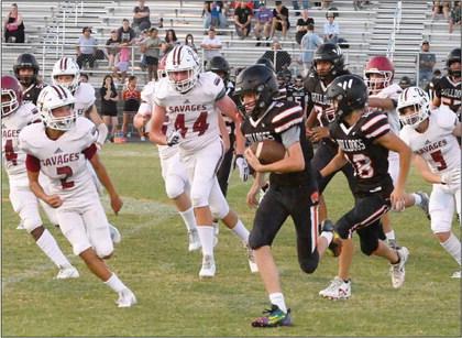 Wynnewood’s #2 Jett Anderson and # 44 Cache Mooney stalk the Wayne runningback down the line. News Star photo by Don Coffey