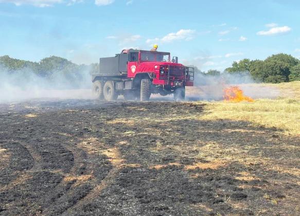 Fire crews from the Rush Creek, Pernell and Elmore City Fire Departments and Bureau of Indian Affairs battled a hay field fire on NCR 3170, north of Liberty Road, earlier this week. Photo courtesy of Elmore City Fire Department