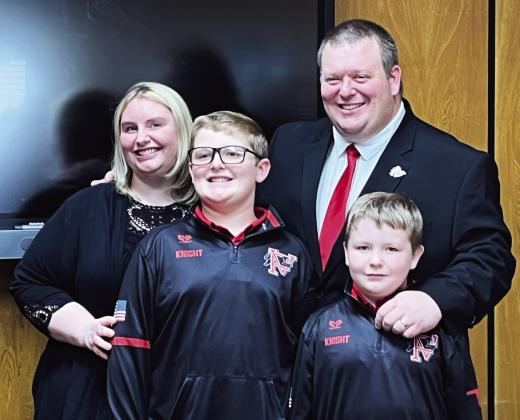 Brett Knight with his wife, Lucy, and their two sons at a special meeting of the Pauls Valley Board of Education April 11. During the meeting, board members voted to hire Knight as superintendent of Pauls Valley Schools beginning July 1. News Star photo by Suzanne Mackey