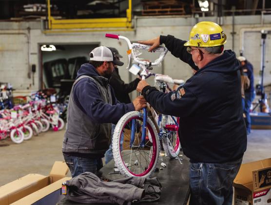 OG&amp;E team members volunteer at Sooner Power Plant to assemble bicycles for distribution to children across the company’s service area.