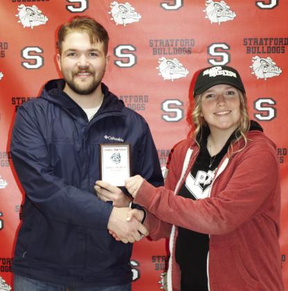 Caleb Stout with Oklahoma Heritage Bank presents Stratford freshman Araya Tackett with her Student of the Month award for November.