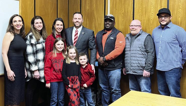 Pauls Valley School Board members hired Adam McPhail as the district’s superintendent Monday. McPhail is pictured center with his wife, Ashley, and their children Adalynn, Addyson and Anderson.