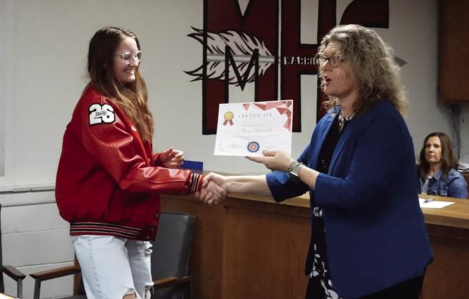 Maysville archery students received certificates of recognition from Superintendent Shelly Hildebrandteam recently placed first at the OKNASP 2023 East Region Tier 2 State Championship in Tulsa. Alea Sherrill (left) scored the third highest individual score at the event. Beach during the Maysville Board of Education's regular meeting Monday. Maysville's archery