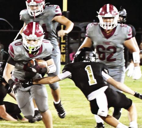 Wynnewood’s #0 Aydrian Knighten, #54 Peyton Henderson and #62 Adrian Hernandez run past Allen’s defender during the Sept. 19 game between the two teams. Wynnewood beat Allen, 48-16, and remain undefeated so far this season. News Star photo by Don Coffey