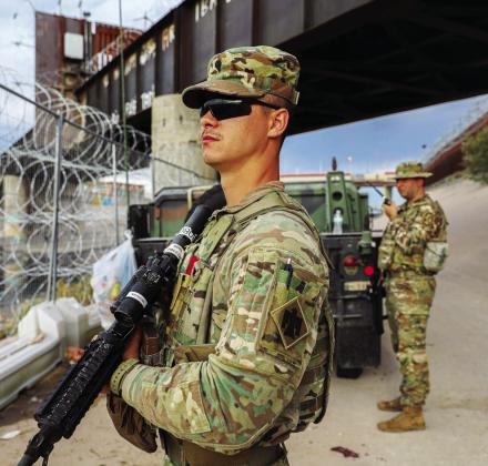 Oklahoma Army National Guard Soldiers, Spc. Blake Morgan (left), member of the 45th Infantry Brigade Combat Team, and Sgt. Chance Minter (right), member of the 45th Field Artillery Brigade, perform border operations along the Rio Grande in El Paso, Texas, on Aug. 16, 2023. (Sgt. Reece Heck/Oklahoma National Guard) 