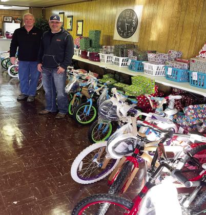 Terry Looney, OG&amp;E construction distribution area supervisor, and Harvey Fisher, OG&amp;E supervisor of area T&amp;D substation operations, delivered 20 brand-new bicycles to the Maysville Daughters Club in December. The bicycles were then distributed to deserving children in the community. Courtesy photo