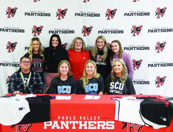 Pauls Valley seniors Madilyn and Caitlyn Hagood signed letters of intent Wednesday to play softball for Southwestern Christian University in Bethany. The sisters are pictured with their parents, Randy and Crystal Hagood, and their Pauls Valley softball teammates. News Star photo by Chris Mackey