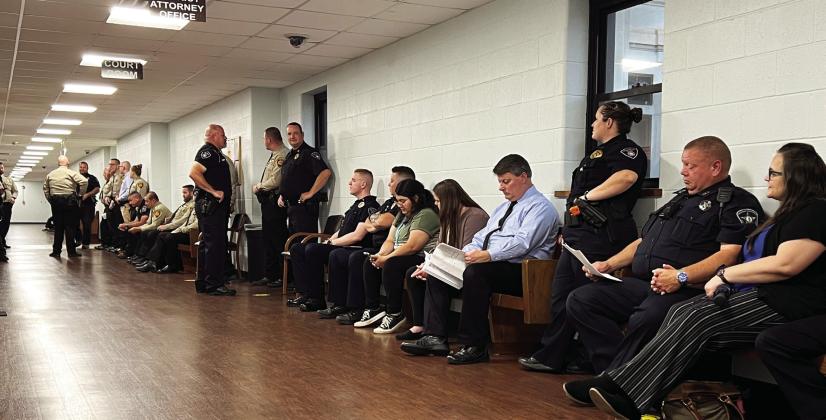 Law enforcement officers from multiple local departments lined the halls outside a courtroom at the Garvin County Courthouse Tuesday morning waiting for a preliminary hearing to begin for William Philpott. The turnout was in support of officers who were shot at during an incident near the Pauls Valley City Lake in June of 2022. News Star photo by Suzanne Mackey