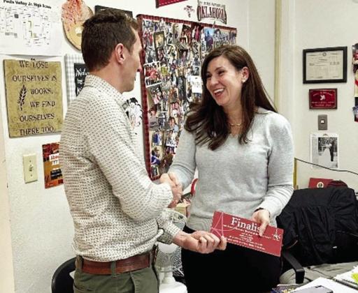 First United Community Bank President J.D. Bostic presents Courtney Green with notification she is a finalist for the 2023 Southeast Oklahoma Teacher of the Year award presented by the Aeros Awards of Excellence. Green teaches eighth grade English at Pauls Valley Junior High School.