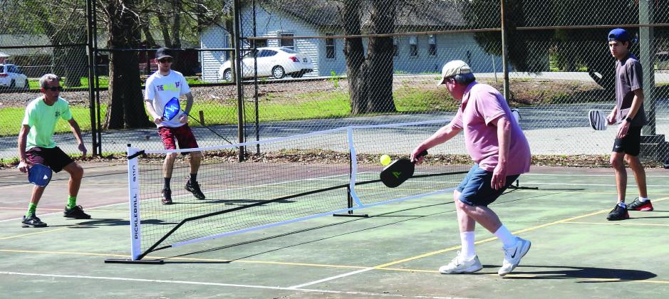 Pickleball competitors enjoy a doubles match during the first-ever Pickle in the Park tournament at Wacker Park April 12. News Star photo by Chris Mackey