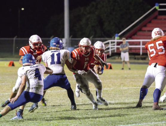 Maysville’s #1 Caden Davis makes a way thru Paoli’s #11 Cobey Williamson and #4 Jett Underwood in last Friday night’s great matchup between Paoli and Maysville. Maysville came out on top this year, 14-6. News Star photo by Denny Park