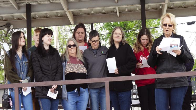 Family members of Tammy Briggs gathered on the Main Street Stage during Saturday’s Footloose Festival as a new award in memory of Briggs was unveiled.