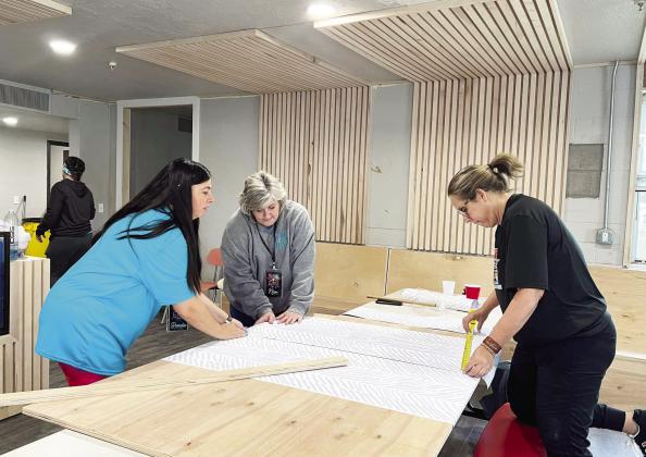 Volunteers help with a decor project for the 99+1 Foundation’s Stratford house during a BIG Life mission retreat in April. The house will serve as a home to young women aging out of foster care and other at-risk women and children.
