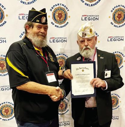 David Hardin (left), commander for the American Legion Ball-Smith Post 23 in Lindsay, receives a certificate of appreciation from a Legion official at the group’s Mid-Winter Conference. The Lindsay post exceeded their membership goal with 112% participation. News Star photo courtesy of Sheryl Kochert.