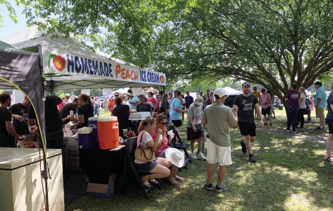 Crowds stand in line for a taste of the Burnett family’s homemade peach ice cream at the 2021 Stratford Peach Festival. Always a big draw, the ice cream stand is a staple at the annual Peach Festival and will be returning again for this year’s event July 15. News Star photo by Chris Mackey