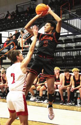 Ryein Kennedy dominates with his mid-range jumper as he puts two more points on the scoreboard for the Leopards against Plainview. Photo courtesy of Sheryl Kochert