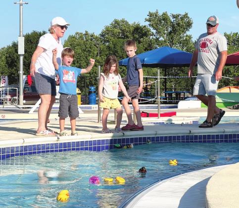 Young participants cheering their ducks on in the 6th Annual Duck Derby at the Pauls Valley Water Park