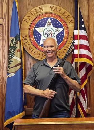 Don Wageman, pictured here with a rifle presented to him by Pauls Valley’s Fraternal Order of Police Lodge in May of 2022, following his retirement as a reserve officer for the Pauls Valley Police Department. Photo courtesy of Derrick Jolley.
